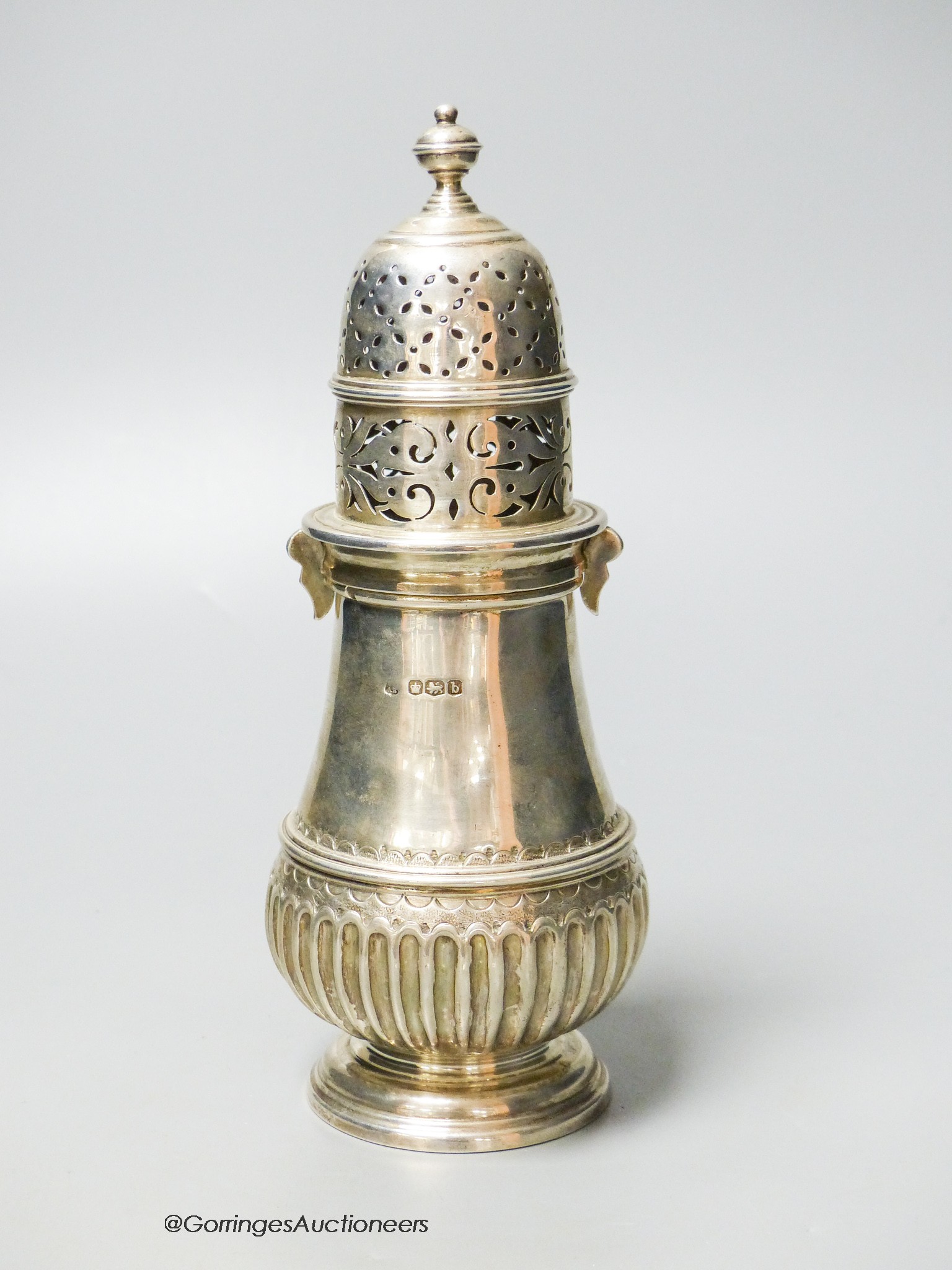 A George V silver baluster sugar caster, Thomas Bradbury & Sons, Sheffield, 1919, 21.3cm, 10oz.